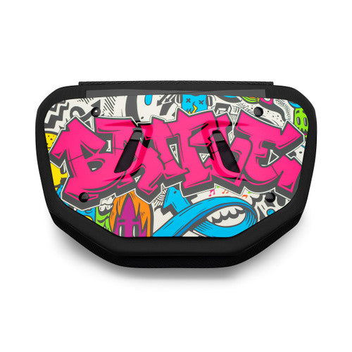 a black Battle back plate with an image of graffiti on it with the word battle written on it in neon pink
