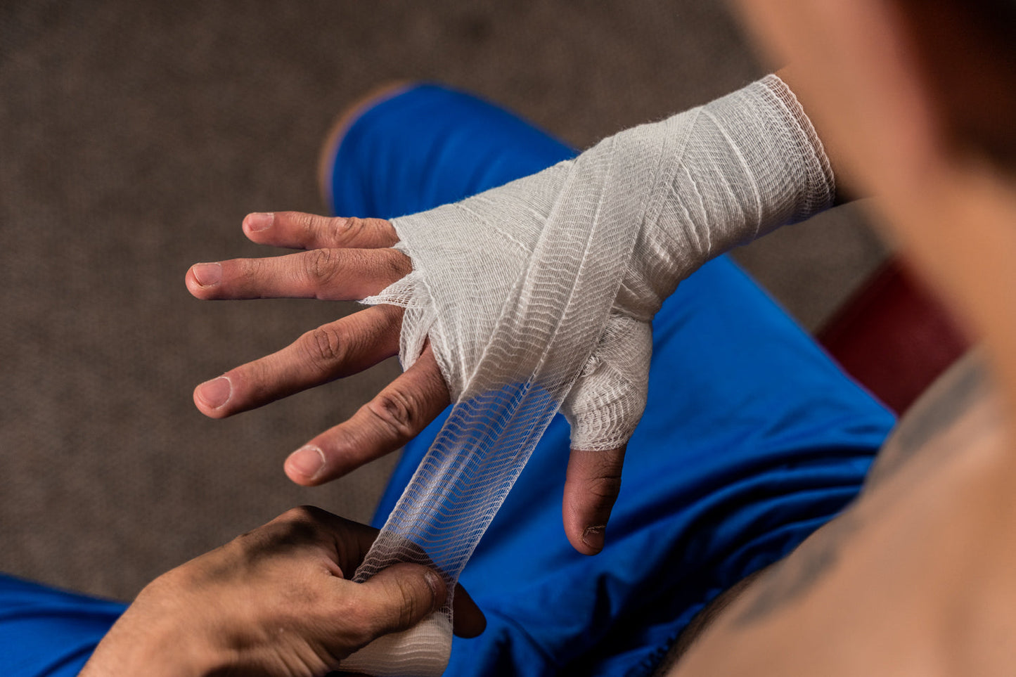 Title Old School Super Gauze wrapped on a boxers hand