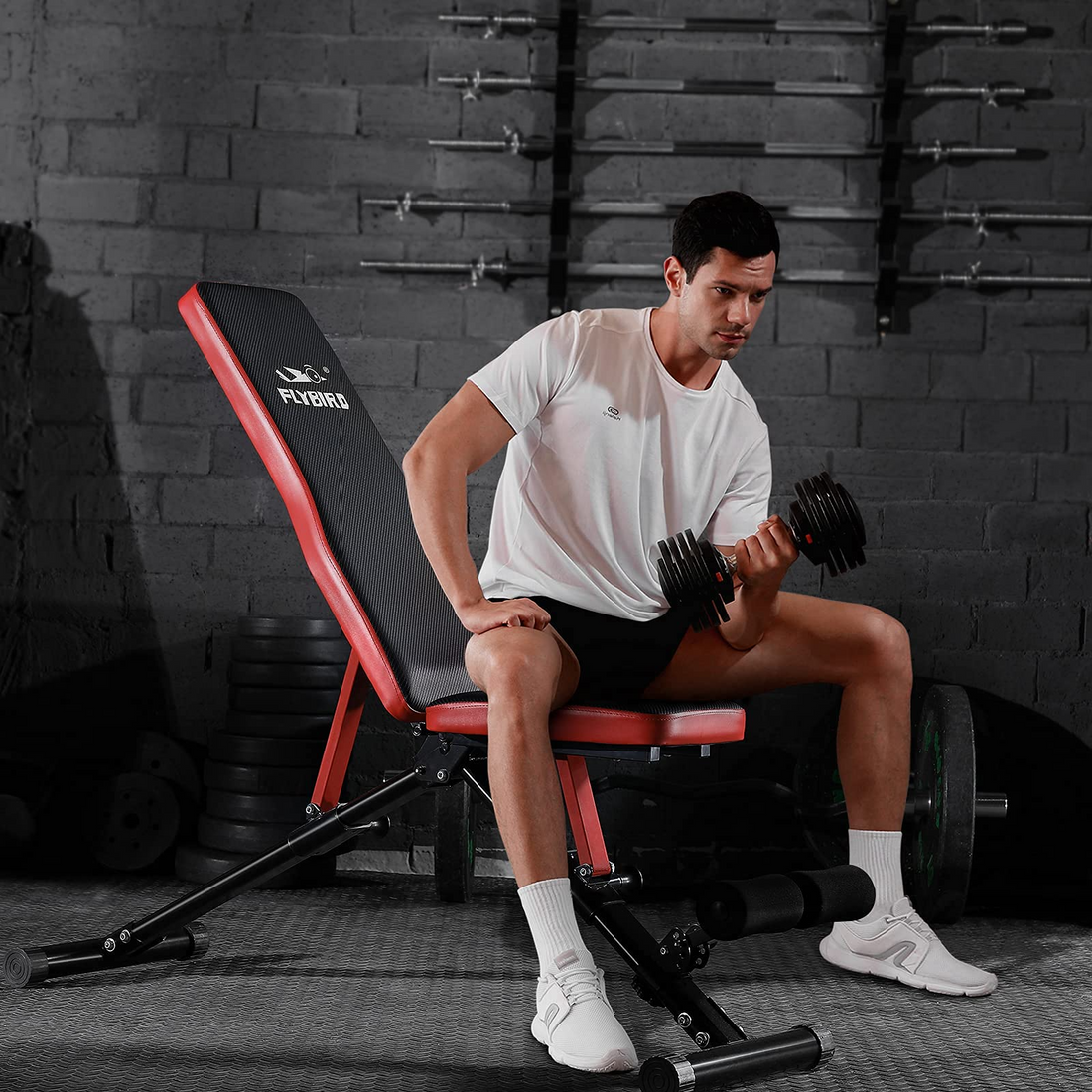 man weight training with adjustable bench