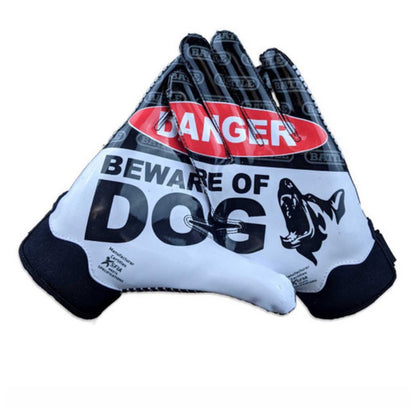 a pair of Battle black and white gloves that say danger beware of dog on it