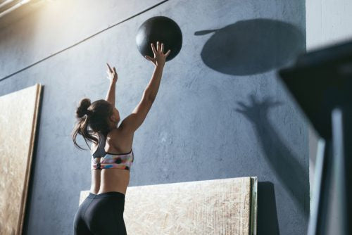 exercise against a wall with a medicine ball